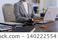 professional lawyer attorney working with laptop computer and justice scales gavel at modern office desk legal consultation services concept business workplace 140222554