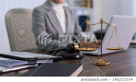 professional lawyer attorney working with laptop computer and justice scales gavel at modern office desk legal consultation services concept business workplace professional lawyer attorney working with laptop computer and justice scales gavel at modern office desk legal consultation services concept business workplace 140222554