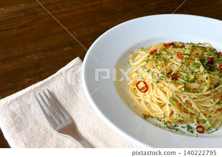 Spaghetti Aglio e Olio in the background of the table Spaghetti Aglio e Olio in the background of the table 140222795