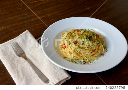 Spaghetti Aglio e Olio in the background of the table Spaghetti Aglio e Olio in the background of the table 140222796