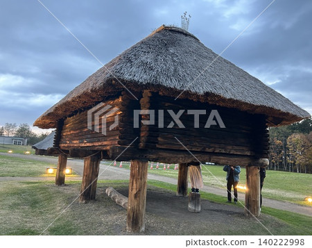 This is a reconstructed, illuminated, post-and-beam building at the Sannai-Maruyama archaeological site, a Jomon period site in Aomori City. This is a reconstructed, illuminated, post-and-beam building at the Sannai-Maruyama archaeological site, a Jomon period site in Aomori City. 140222998