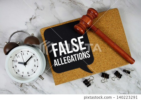 False Allegations text on speech bubble with alarm clock and wooden gavel on marble background False Allegations text on speech bubble with alarm clock and wooden gavel on marble background 140223291
