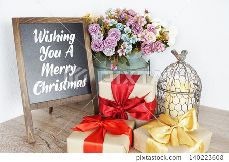 Wishing You A Merry Christmas message written on easel blackboard Wishing You A Merry Christmas message written on easel blackboard 140223608