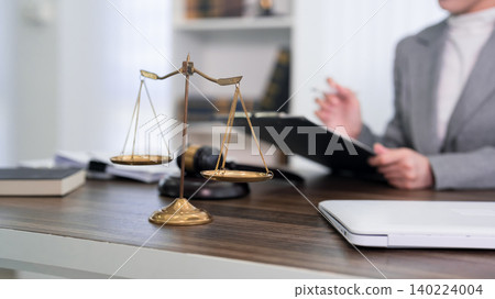 lawyer attorney legal professional office consultation justice scales gavel desk indoor workplace formal meeting law firm environment practice suit documents 140224004