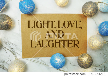Light, Love and Laughter text written on paper card with LED cotton balls decorations Light, Love and Laughter text written on paper card with LED cotton balls decorations 140224215