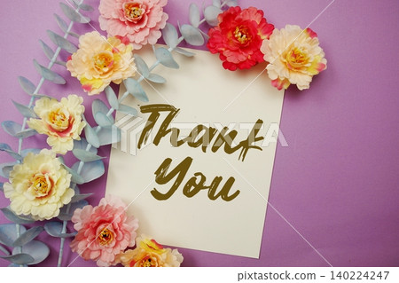 Thank You text written on paper card with flowers decoration 140224247