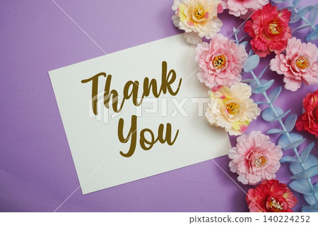 Thank You text written on paper card with flowers decoration Thank You text written on paper card with flowers decoration 140224252
