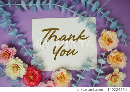 Thank You text written on paper card with flowers decoration 140224254
