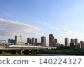 The N700A/N700S "Nozomi," "Hikari," and "Kodama" trains of the Tokaido Shinkansen cross the Tamagawa River, heading towards Tokyo. 140224327