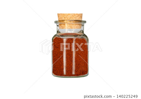 ground chili pepper in glass container isolated on white background ground chili pepper in glass container isolated on white background 140225249