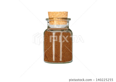 ground nutmeg in glass container isolated on white background ground nutmeg in glass container isolated on white background 140225255