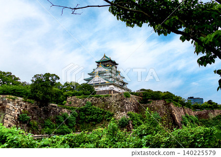 [Osaka] Osaka Castle in summer: The castle tower viewed through the trees 140225579