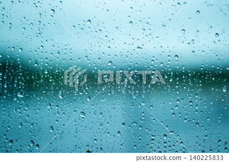 Raindrop attached to window glass 140225833