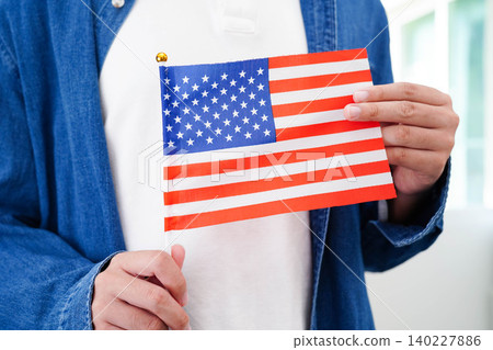 Learn English language, Asian teenage student hold book with flag in course at school. Learn English language, Asian teenage student hold book with flag in course at school. 140227886