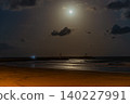 Full Moon Over Calm Nighttime Beach Waters 140227991