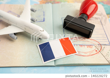 France flag and passport with airplane for travel. France flag and passport with airplane for travel. 140228272