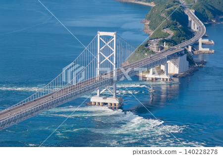 The main towers of the Great Naruto Bridge and the whirlpools spreading across the Naruto Strait The main towers of the Great Naruto Bridge and the whirlpools spreading across the Naruto Strait 140228278