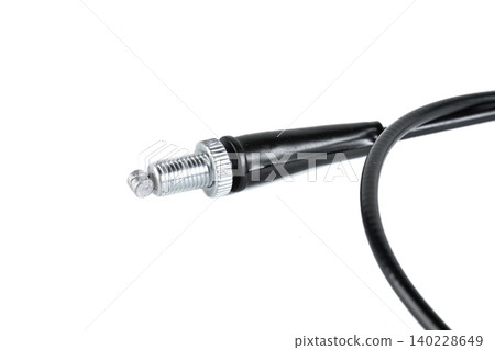 Motorcycle throttle cable barrel adjuster with knurled lock nut close up. 140228649