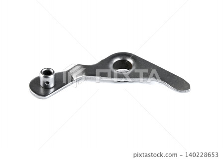 Motorcycle engine gear shift selector stopper lever arm isolated on white background. Motorcycle engine gear shift selector stopper lever arm isolated on white background. 140228653