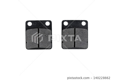 Motorcycle disc brake pad set with friction lining and steel backing plate top view. Motorcycle disc brake pad set with friction lining and steel backing plate top view. 140228662