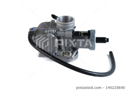 Motorcycle engine aluminum carburetor assembly with fuel rubber hose on white. Motorcycle engine aluminum carburetor assembly with fuel rubber hose on white. 140228690