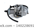 Motorcycle engine aluminum carburetor assembly with adjustment screw isolated on white. 140228691