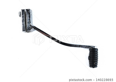 Motorcycle steel gear shift lever assembly with rubber toe peg on white top view. Motorcycle steel gear shift lever assembly with rubber toe peg on white top view. 140228693