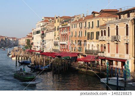 Italy, Venice Old Town: A view of the Grand Canal and cityscape from the Rialto Bridge in the early morning. Italy, Venice Old Town: A view of the Grand Canal and cityscape from the Rialto Bridge in the early morning. 140228825