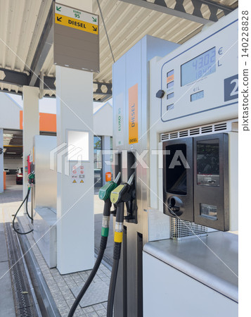 Fuel Nozzles at Modern Gas Station Pump Fuel Nozzles at Modern Gas Station Pump 140228828