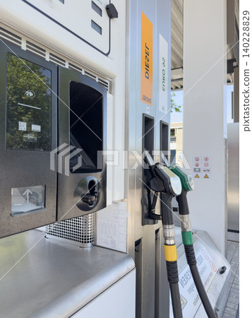 Fuel Nozzles at Modern Gas Station Pump Fuel Nozzles at Modern Gas Station Pump 140228829