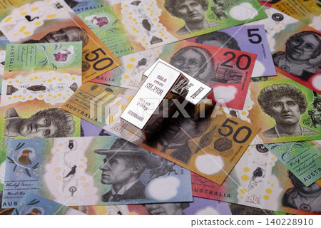 A silver bar, white metal against a backdrop of Swiss flag, as a concept for the sales. A silver bar 140228910