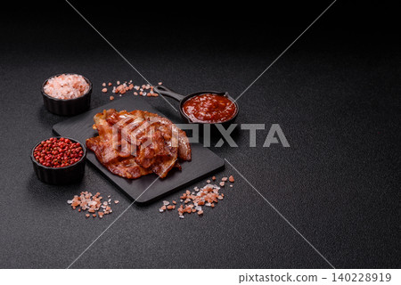 Fried fresh bacon slices with layers of meat or prosciutto with salt and spices. Fried bacon Fried fresh bacon slices with layers of meat or prosciutto with salt and spices. Fried bacon 140228919