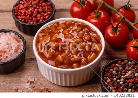Beans in tomato sauce, a canned stew for the dinner table. Beans in tomato sauce Beans in tomato sauce, a canned stew for the dinner table. Beans in tomato sauce 140228921