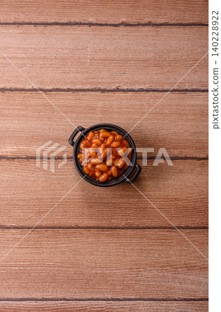 Beans in tomato sauce, a canned stew for the dinner table. Beans in tomato sauce Beans in tomato sauce, a canned stew for the dinner table. Beans in tomato sauce 140228922