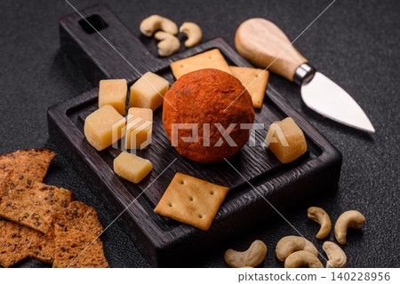 Aged Belper Knolle cheese with jam, crackers, and nuts. Belper Knolle cheese Aged Belper Knolle cheese with jam, crackers, and nuts. Belper Knolle cheese 140228956
