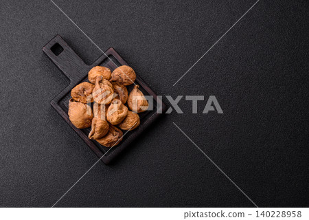 Dried whole fig as an ingredient for sweet desserts. Dried figs as a food Dried whole fig as an ingredient for sweet desserts. Dried figs as a food 140228958