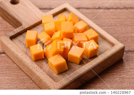 Hard yellow cheddar cheese for sandwiches or pasta. Cheddar cheese Hard yellow cheddar cheese for sandwiches or pasta. Cheddar cheese 140228967