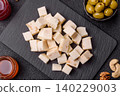 White feta, tofu, or mozzarella cheese cubes with herbs. White mozzarella cheese 140229003