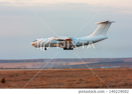 White wide body transport cargo airplane landing White wide body transport cargo airplane landing 140229082