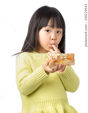 Asian Little Girl Eating Sandwich as Healthy Meal Asian Little Girl Eating Sandwich as Healthy Meal 140229543