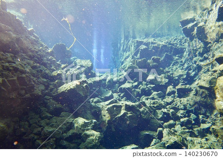 A scene of people enjoying scuba diving at Silfra Rift in Þingvellir National Park, Iceland. A scene of people enjoying scuba diving at Silfra Rift in Þingvellir National Park, Iceland. 140230670