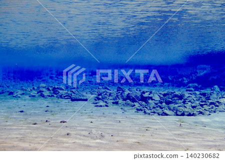 A scene of people enjoying scuba diving at Silfra Rift in Þingvellir National Park, Iceland. A scene of people enjoying scuba diving at Silfra Rift in Þingvellir National Park, Iceland. 140230682