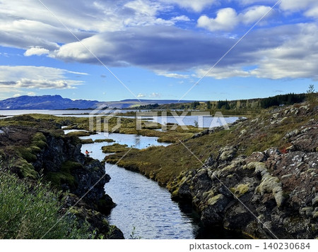 A scene of people enjoying scuba diving at Silfra Rift in Þingvellir National Park, Iceland. A scene of people enjoying scuba diving at Silfra Rift in Þingvellir National Park, Iceland. 140230684