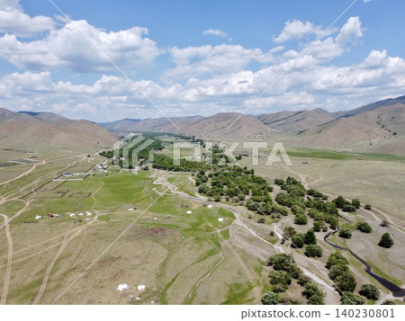 A scene of people enjoying horseback riding on the vast grasslands outside Ulaanbaatar, Mongolia. 140230801
