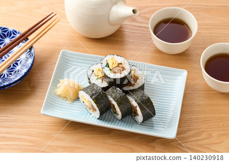 Thick sushi rolls served on a plate Thick sushi rolls served on a plate 140230918