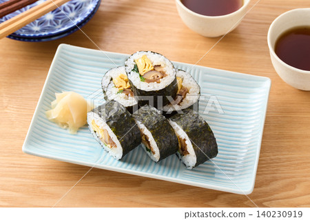 Thick sushi rolls served on a plate Thick sushi rolls served on a plate 140230919