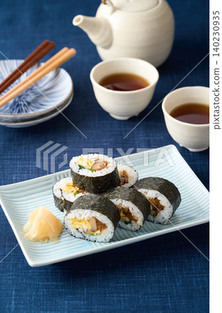 Thick sushi rolls served on a plate Thick sushi rolls served on a plate 140230935