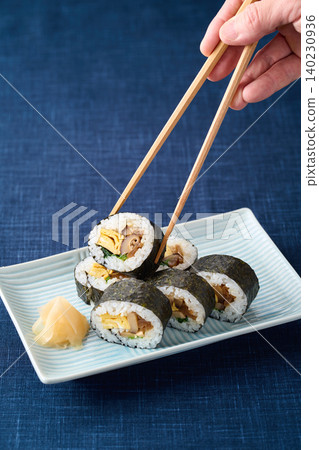 Thick sushi rolls served on a plate Thick sushi rolls served on a plate 140230936