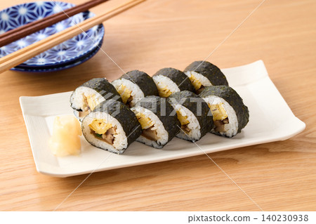 Thick sushi rolls served on a plate Thick sushi rolls served on a plate 140230938