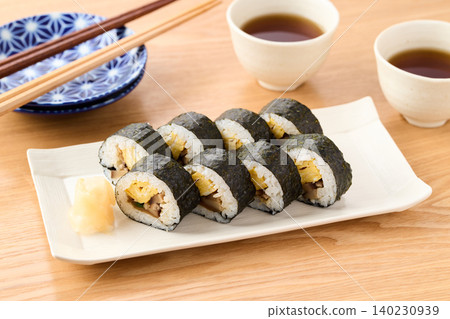 Thick sushi rolls served on a plate Thick sushi rolls served on a plate 140230939